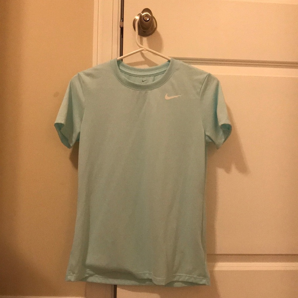 Blue Nike tee.